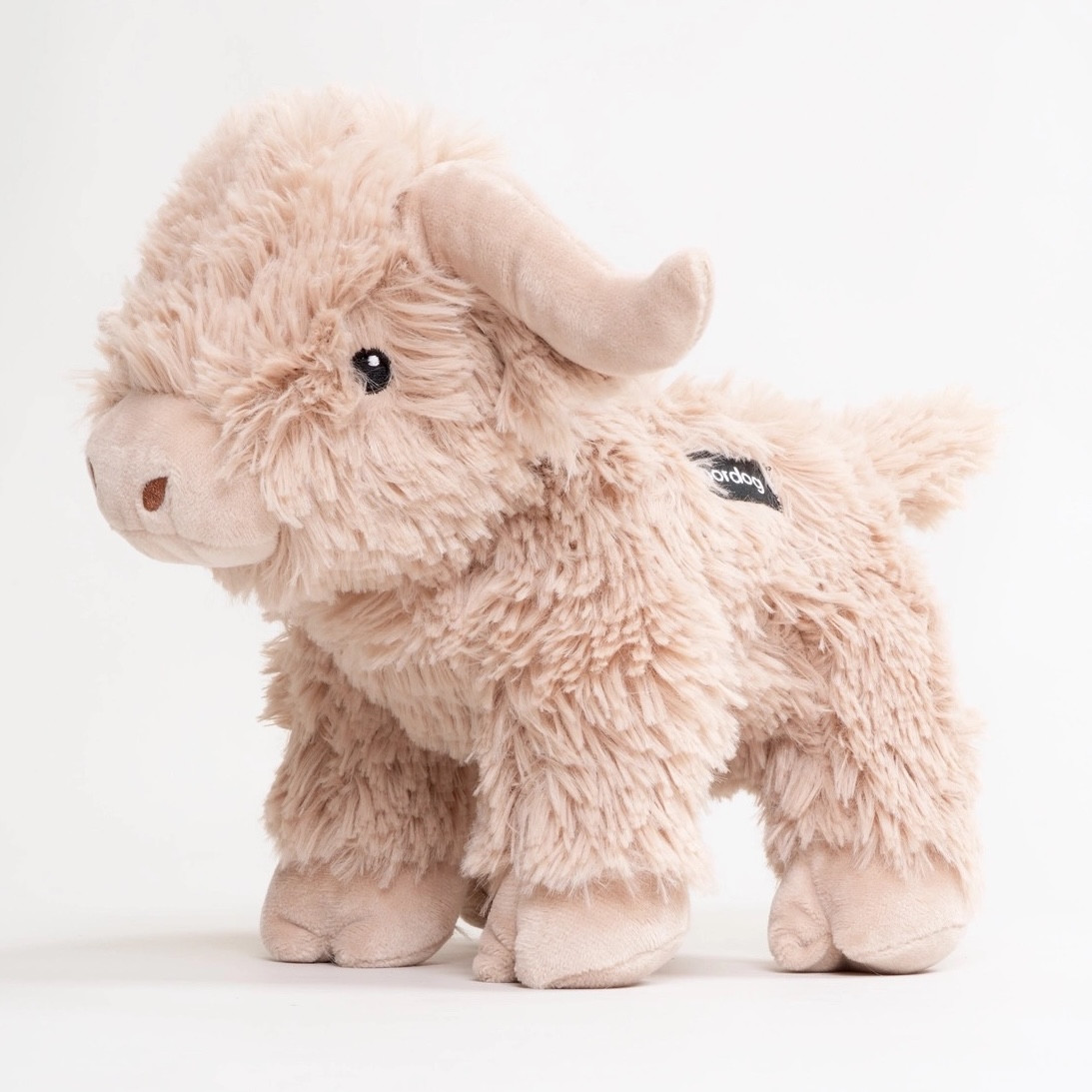 Pörröinen vaalea koiran pehmolelu Mathilde the Highland Cow.