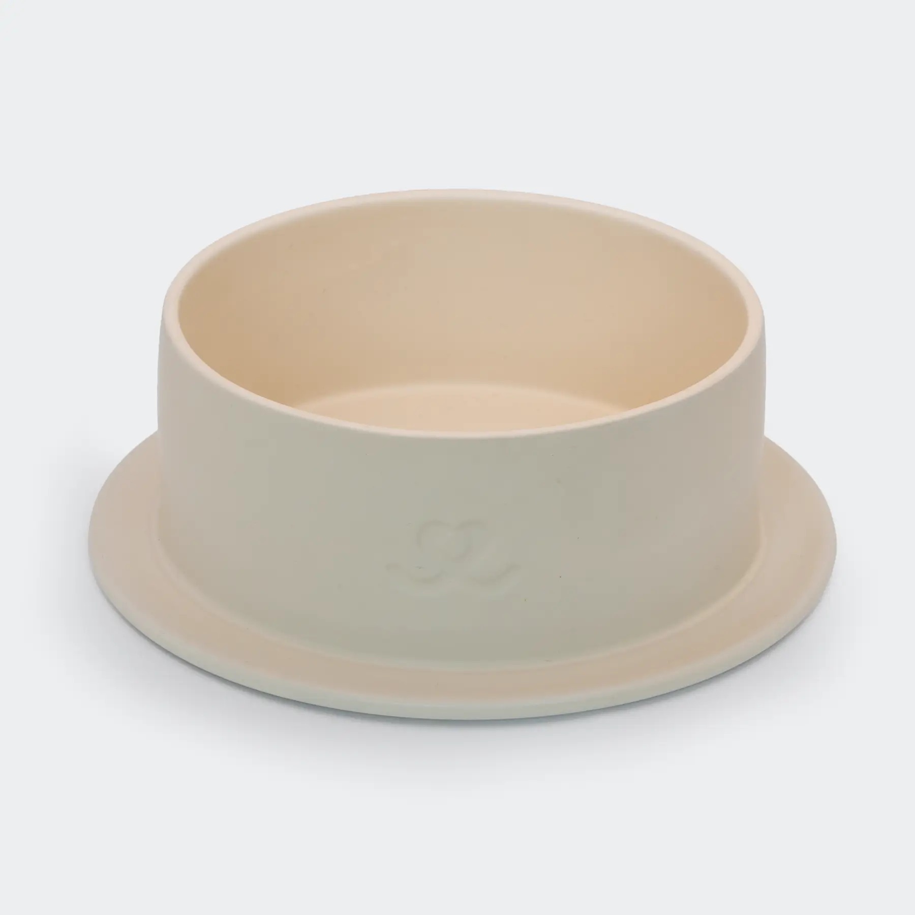 Eggwhite sävyinen koiranruokakuppi, jossa on kohokuvio ja sisäpinta vaaleanbeige.
